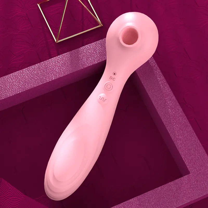 Stimulateur clitoridien Besh rose sur fond violet, style glamour