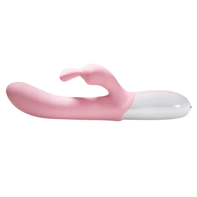 Vibromasseur rabbit rose posé à plat, vue de profil