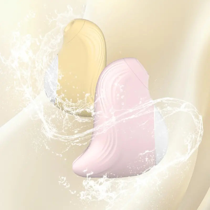 Stimulateur Penguin rose et jaune éclaboussé d’eau, 100 % waterproof IPX6