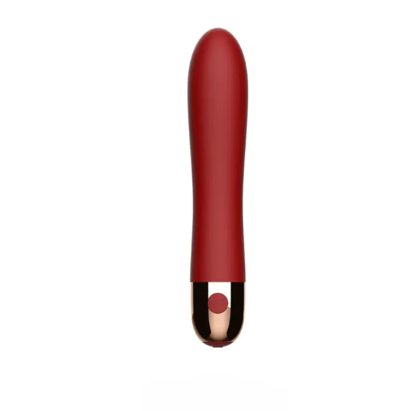 Vibromasseur rouge double moteur au design chic avec finition dorée, parfait pour des sensations intimes raffinées.