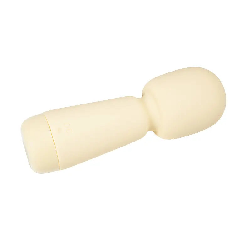 Vibromasseur beige Ivy allongé, vue latérale montrant le port de chargement